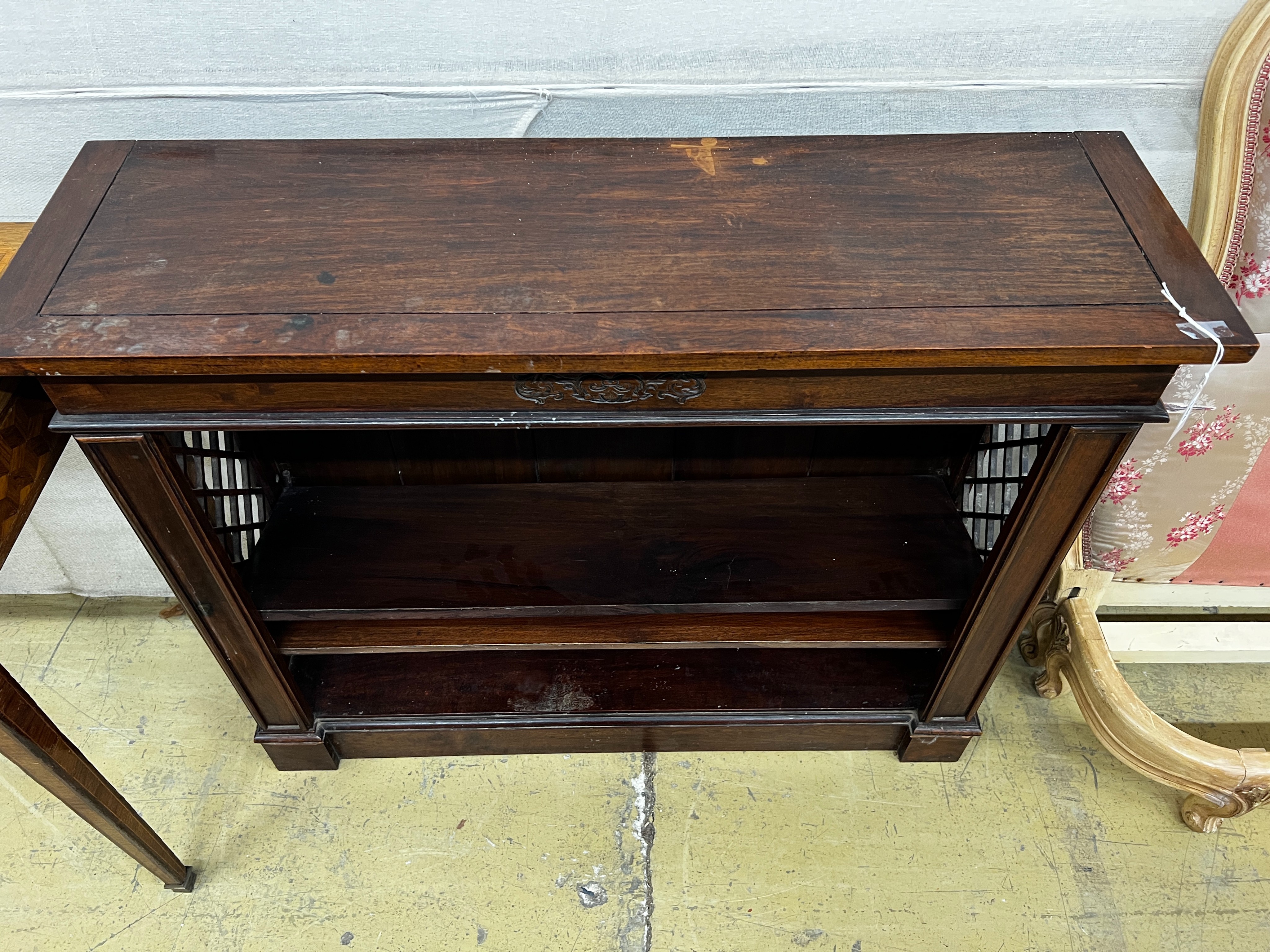 A reproduction hardwood dwarf open bookcase, width 107cm, depth 33cm, height 85cm